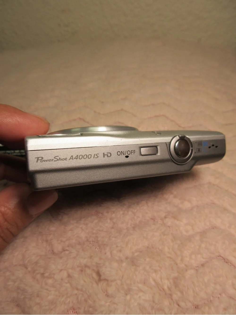 Canon Silver Compact Camera with Black Charger and Accessories